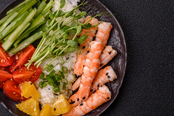 A prawn or shrimp bowl with rice, tomatoes, sauce, and vegetables, Asian food. Prawn or shrimp