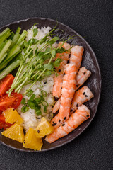 A prawn or shrimp bowl with rice, tomatoes, sauce, and vegetables, Asian food. Prawn or shrimp