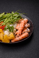 A prawn or shrimp bowl with rice, tomatoes, sauce, and vegetables, Asian food. Prawn or shrimp