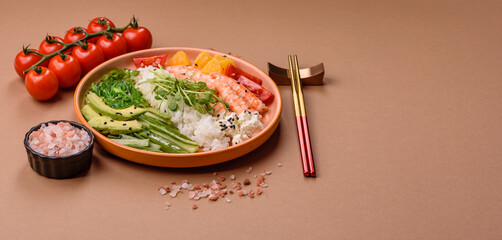A prawn or shrimp bowl with rice, tomatoes, sauce, and vegetables, Asian food. Prawn or shrimp