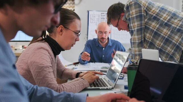 collaborative programming workshop atmosphere, developer and mentor engaged in handson coding activity, team of developers working closely with mentor during intensive coding and review session