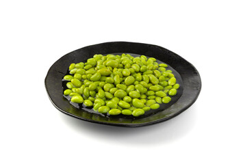 Edamame beans isolated. Green soy bean pile, cooked young soybean, boiled Japanese pea