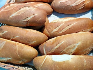 Freshly Baked Wheat Bread Rolls in a Rustic Basket From a Local Bakery in the Early Morning