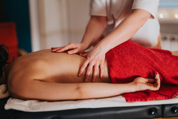 A soothing massage session emphasizing relaxation and well being, featuring tranquil surroundings and expert technique.