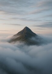 Serene mountain peak above clouds