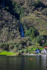 A lonely canoe at the bottom of a waterfall in Bakka, Norway