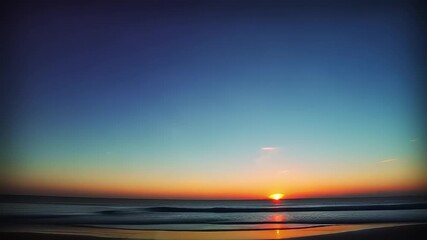 Couple cycling on beach during sunset with beautiful sky colors.