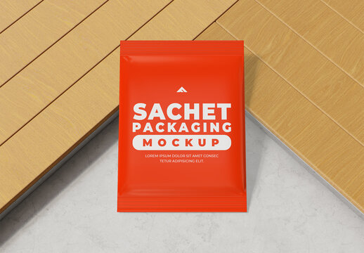 Small Sachet Packaging Mockup on Wooden Background for Samples or Condiments