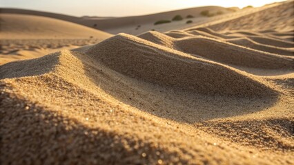 Fototapeta premium Close up view of sand dunes bathed in warm sunlight