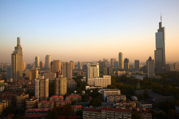 Naklejka premium Aerial view of Zifeng Tower and Nanjing city skyline sunrise, China