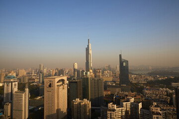 Naklejka premium Aerial view of Zifeng Tower and Nanjing city skyline sunrise, China
