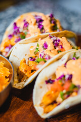 Chicken chipotle tacos in a bright modern Mexican food restaurant