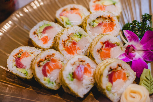 Close up of delicious sushi with tuna and salmon on an textured plate at a Japanese hibachi restaurant 
