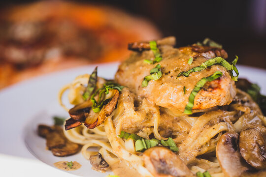 A plate of chicken marsala at an upscale Italian food restaurant