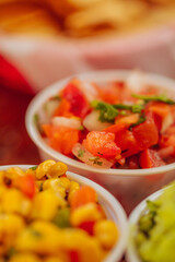 A closeup of various salsas at a mexican restaurant