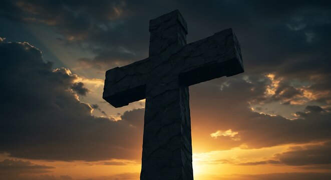 Silhouette of a cross against a dramatic sunset sky conceptual imagery