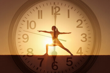 Female silhouette practicing yoga, body health balance, early morning exercise 