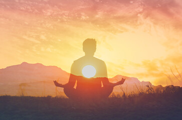 Silhouette of a man Practicing Yoga Meditation at Sunset Finding Inner Peace and Balance