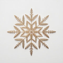 Golden snowflake geometric pattern fern leaf ornamental design minimal style white background festive decor winter theme delicate craft symmetrical shape serene