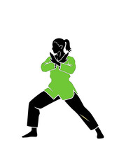 Female Taekwondo athlete in defensive stance ready to fight.