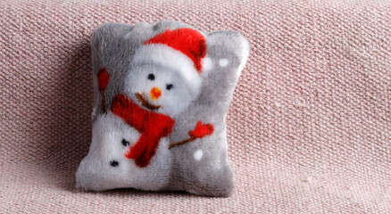 Cushion with snowmann on a sofa