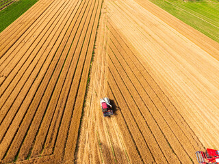 Combine harvester working on a wheat field，Aerial photos