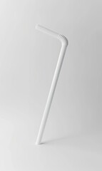 White bendy straw, drink aid, on a table in light room. Beverage/Drink Photo asset