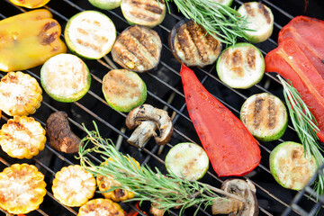 Vegetarian barbeque. Many different cooked vegetables on grill, closeup
