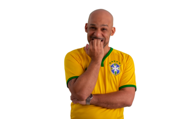 male fan wearing a yellow Brazilian football shirt