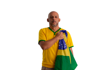 male fan wearing a yellow Brazilian football shirt and the Brazilian flag