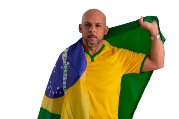male fan wearing a yellow Brazilian football shirt and the Brazilian flag