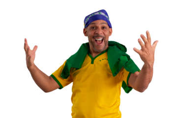 male fan wearing a yellow Brazilian football shirt and the Brazilian flag