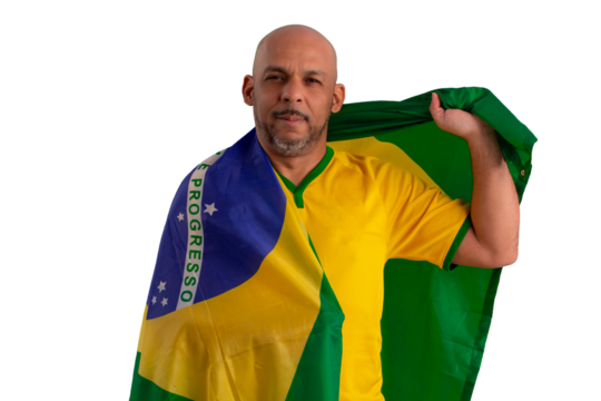 male fan wearing a yellow Brazilian football shirt and the Brazilian flag