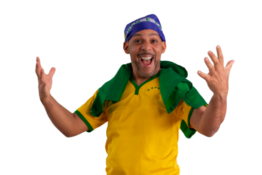 male fan wearing a yellow Brazilian football shirt and the Brazilian flag