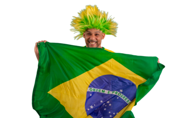 male fan wearing a yellow Brazilian football shirt and the Brazilian flag