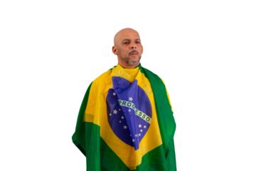 male fan wearing a yellow Brazilian football shirt and the Brazilian flag