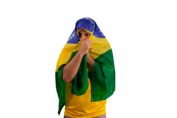 male fan wearing a yellow Brazilian football shirt and the Brazilian flag