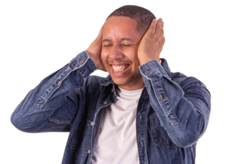 Young adult man wearing a blue denim jacket, with a white shirt in studio shots with a pink background and making various facial expressions showing various feelings