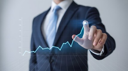 Businessman pointing at a glowing upward trending financial graph on a futuristic interface