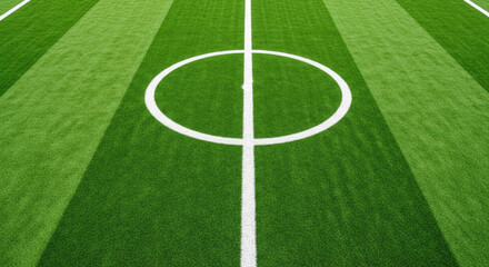 Obraz premium Aerial view of green soccer field center circle with white markings and striped grass pattern, perfect for sports backgrounds