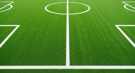 Obraz premium Close-up of clean empty soccer field with white lines on green grass background, perfect for sports and outdoor activities