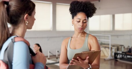 Fitness, clipboard or women in studio with conversation, planning or sign up for personal training class. Pilates, discussion or coach in gym with checklist, recruitment or agreement in contract.