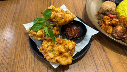 Crispy Indonesian Corn Fritters on White Plate
