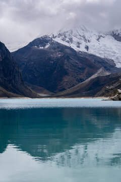 Huaraz, Peru: Reflection of the Laguna Paron and the iconic Piramied Peak in Cordillera Blanca, a famous mountain lake near Caraz in Peru