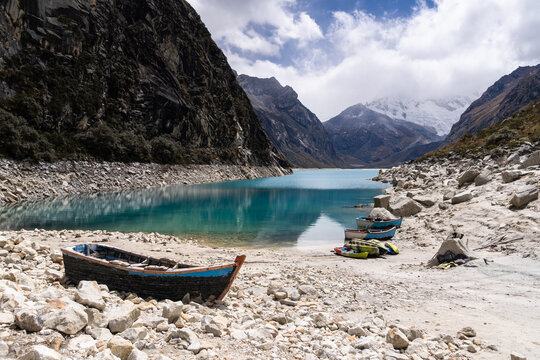 Huaraz, Peru:  Laguna Paron with a dramatic sky and the Piramied Peak in Cordillera Blanca, a famous mountain lake near Caraz in Peru