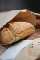 Freshly baked bread in a rustic setting with paper wrap