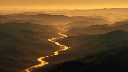 Golden River Winding Through Misty Mountains at Sunset.