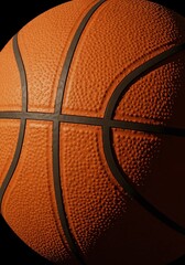 Basketball Texture with shadow: A textured basketball detailed close-up, the spherical shape is showcased, displaying the intricate details and patterns with stark shadow and light.