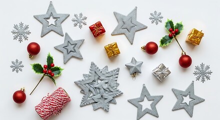 A collection of festive Christmas ornaments including stars, snowflakes, baubles, and gift boxes arranged on a white background.