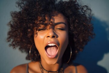 Portrait of a woman of African descent with an open mouth